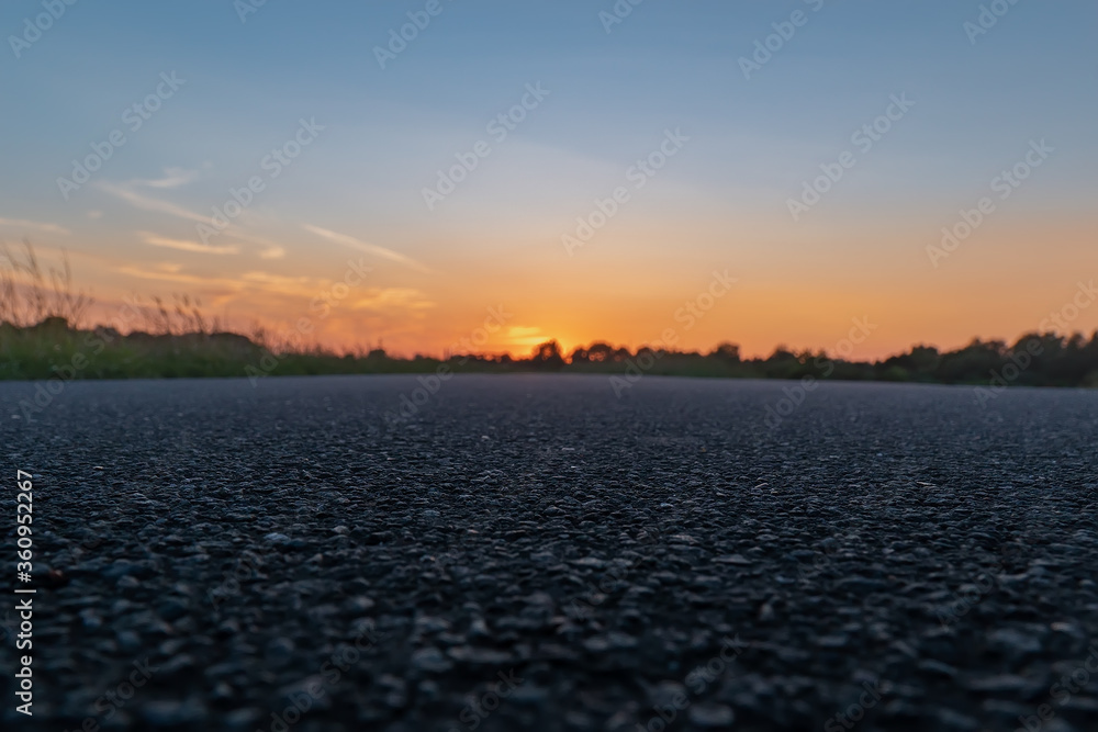 Landscape nature empty road street with green plant under sunset background change to gold natural light color of beautiful grass wheat meadow prairie field in summer sun clear sky Landscape nature empty road street with green plant under sunset background change to gold natural light color of beautiful grass wheat meadow prairie field in summer sun clear sky