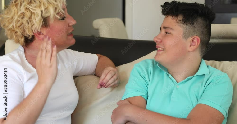 Angry mother and her teenage son yelling at each other Angry mother and her teenage son yelling at each other