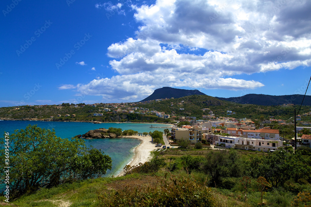 View from the hill to the coast, houses and mountains of Crete in good Sunny weather and the village of Almyrida.