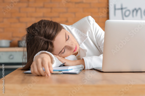 Young woman falling asleep ...