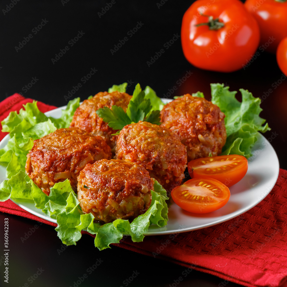 Appetizing meat balls in tomato sauce on a dark background. High protein dish. Appetizing meat balls in tomato sauce on a dark background. High protein dish.