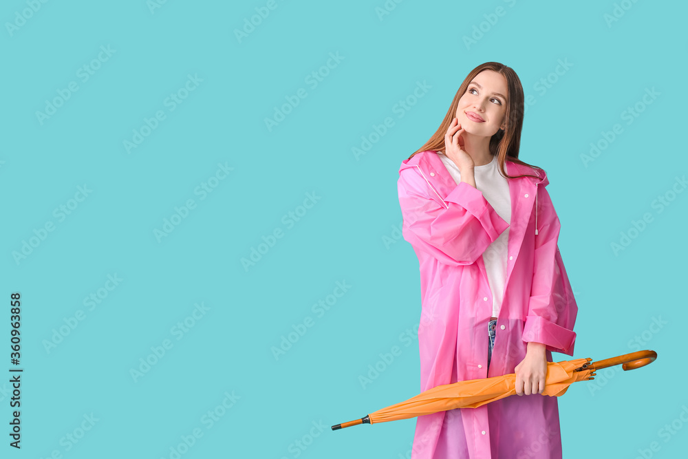 Beautiful woman with umbrella on color background Beautiful woman with umbrella on color background