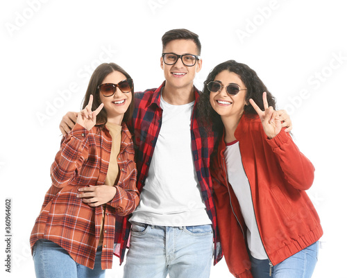 Young friends showing victo...