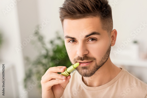 Handsome young man with lip...
