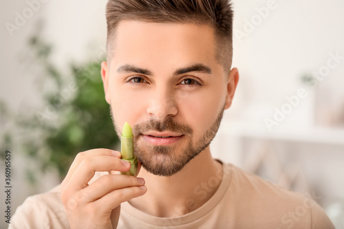 Handsome young man with lip...