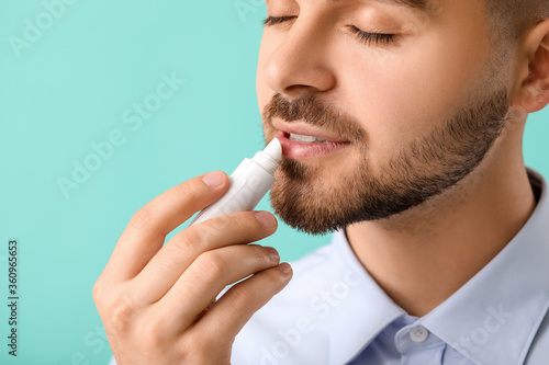 Handsome young man with lip...