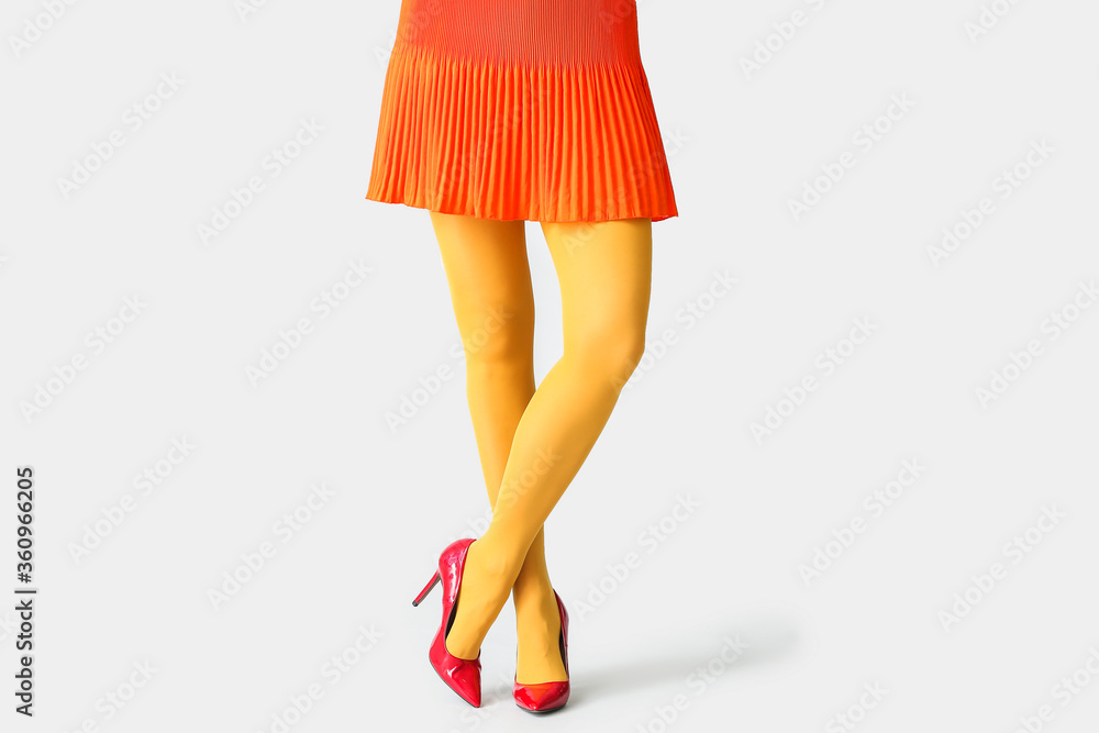 Beautiful young woman in tights on light background Beautiful young woman in tights on light background
