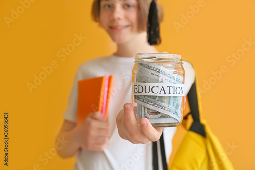 Teenage boy with savings fo...