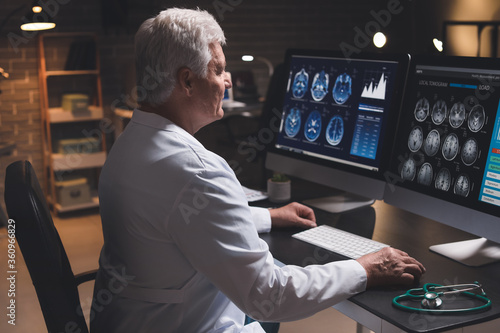 Senior neurologist with MRI...