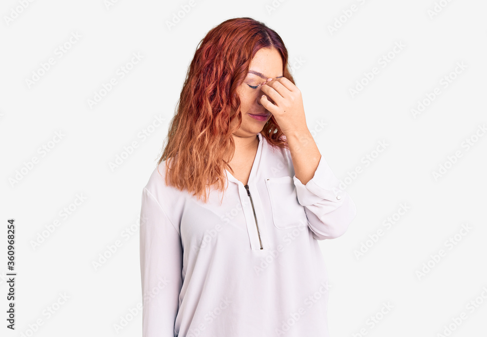 Young latin woman wearing casual clothes tired rubbing nose and eyes feeling fatigue and headache. stress and frustration concept. Young latin woman wearing casual clothes tired rubbing nose and eyes feeling fatigue and headache. stress and frustration concept.