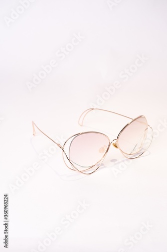 Vertical shot of Clubmaster sunglasses isolated on white background photo