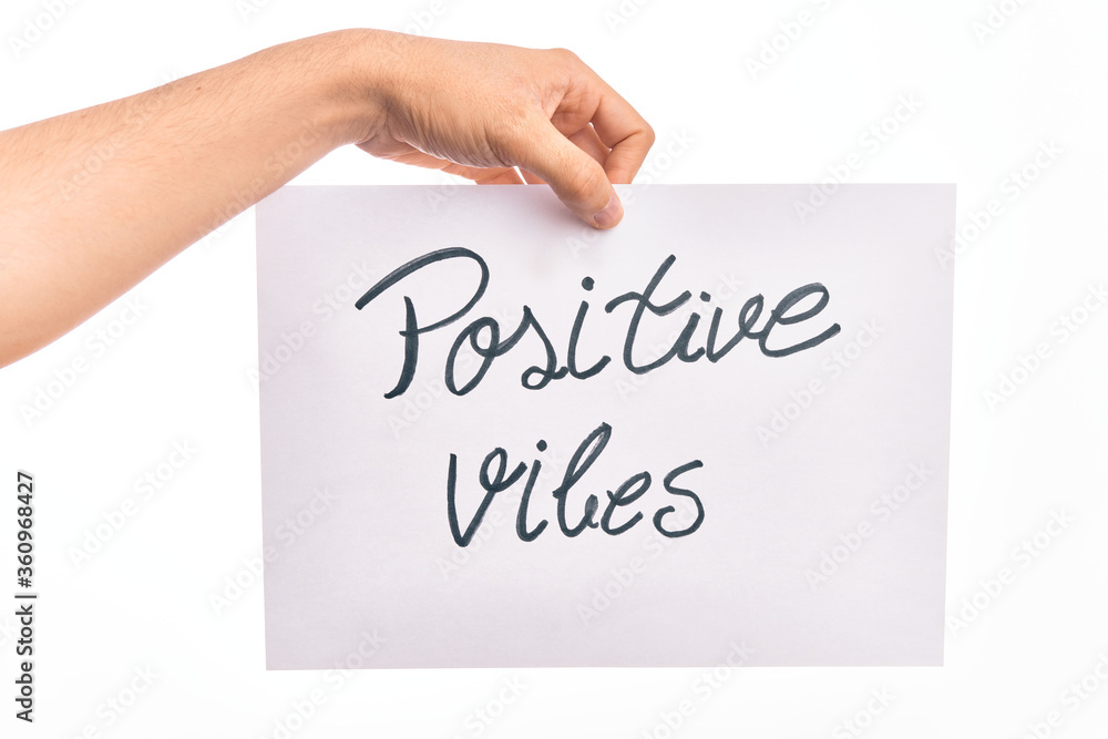 Cardboard banner with POSITIVE VIBES text over isolated white background Cardboard banner with POSITIVE VIBES text over isolated white background