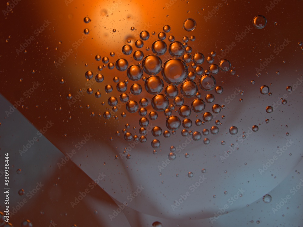 Closeup orange bubbles oil with soft focus and blurred background ,macro image ,abstract background ,water droplets, soap bubbles ,sweet color for card design water drops on glass Closeup orange bubbles oil with soft focus and blurred background ,macro image ,abstract background ,water droplets, soap bubbles ,sweet color for card design water drops on glass