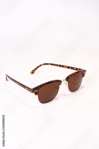 Vertical shot of clubmaster sunglasses isolated on white background photo