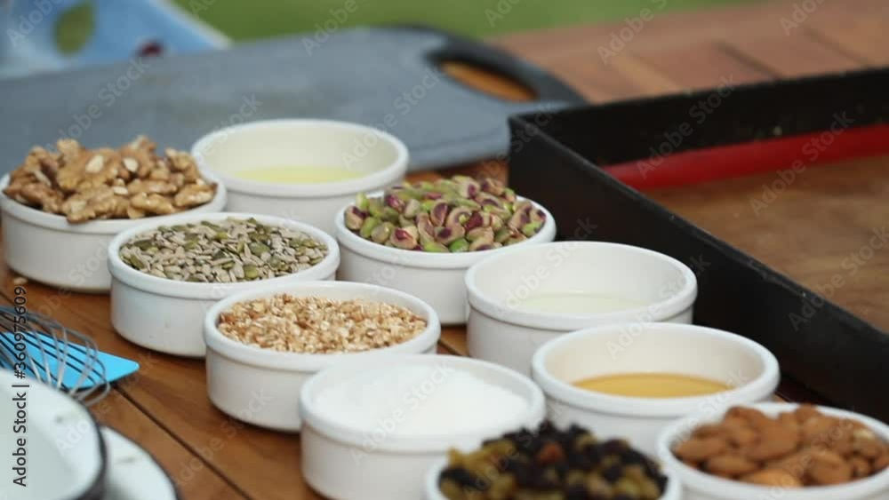 preparing homemade granola with yogurt preparing homemade granola with yogurt