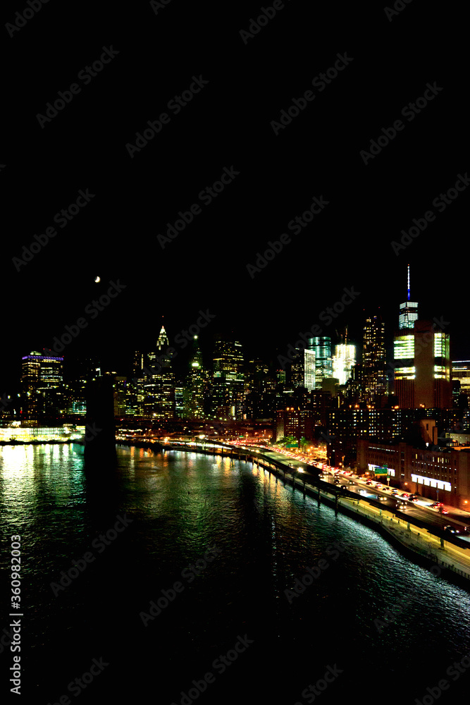 Fototapeta premium New York, NY, U.S.A. - Night view of East River and Financial District in Manhattan