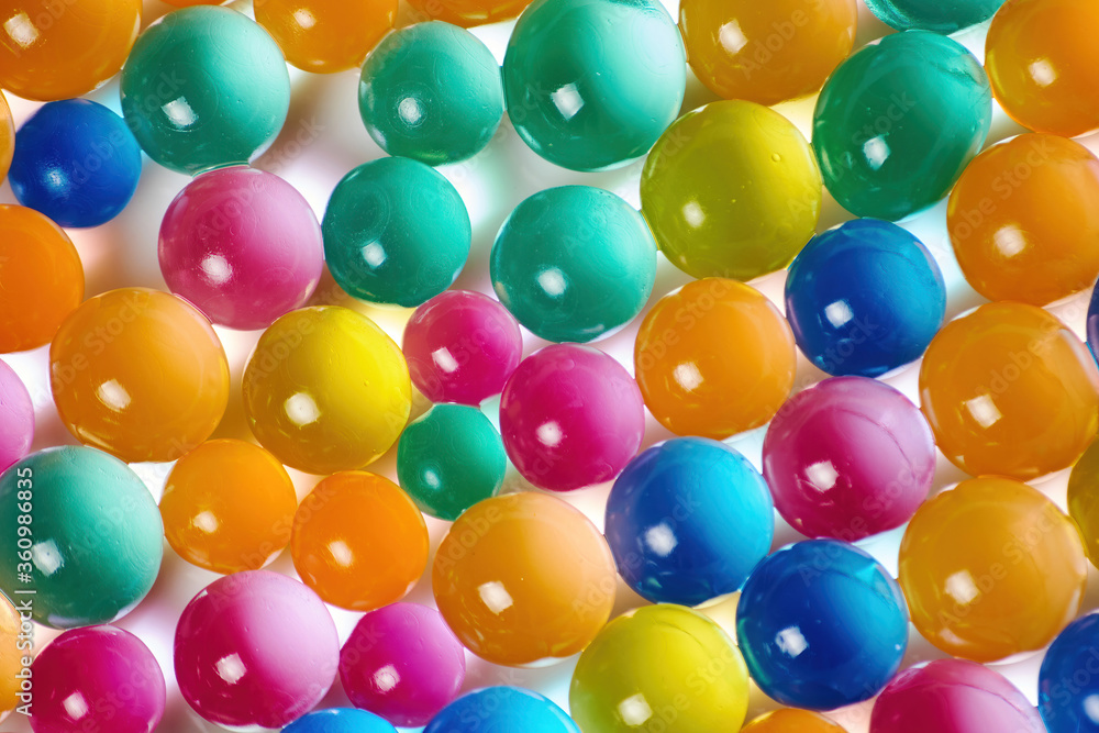 Sweet jelly balls background pattern. Dessert balls scattered on the table. Colorful backdrop with transparent candy