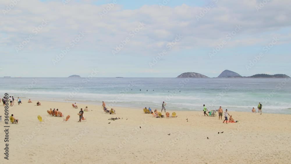People hanging out at Ipanema beach, Guanabara bay, Rio de Janeiro, Brazil. People hanging out at Ipanema beach, Guanabara bay, Rio de Janeiro, Brazil.
