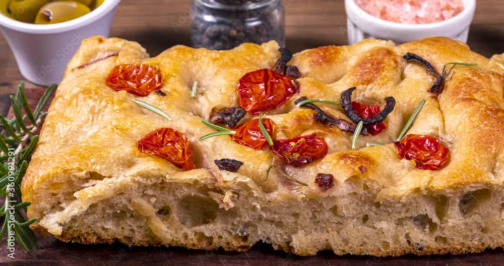 Traditional Italian Focaccia with pepperoni, cherry tomatoes, black