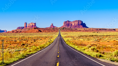 Highway 163 leading to the towering sandstone Buttes and Mesas of the Monument Valley Navajo Tribal Park in Utah-Arizona, United States. 'Forest Gump Point' where he stopped his cross country run