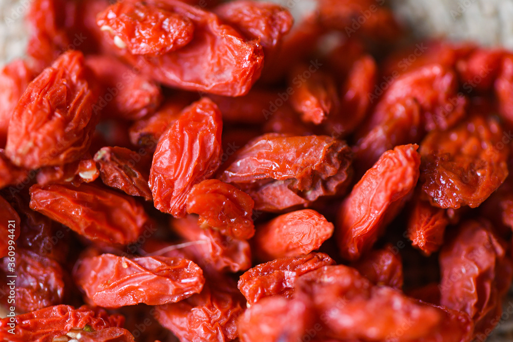 goji berry dry spices and herbs food ingredients - goji berries on background goji berry dry spices and herbs food ingredients - goji berries on background