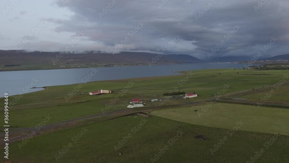 Aerial View, Horse Farm, Dusk, Barn, Running Horses, Akureyri Port (City), Eyjafjörður Fjord, Iceland, Orbit To The Left (Camera Movement) Aerial View, Horse Farm, Dusk, Barn, Running Horses, Akureyri Port (City), Eyjafjörður Fjord, Iceland, Orbit To The Left (Camera Movement)
