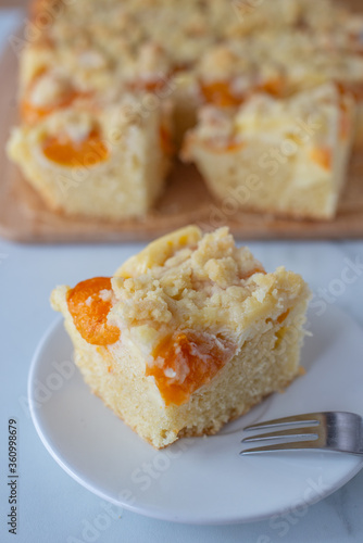 home made german apricot streusel cake on a table