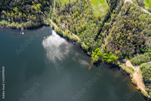 aerial view of forest and blue lake with clouds reflection. Vyacha lake, Belarus. © Mr Twister