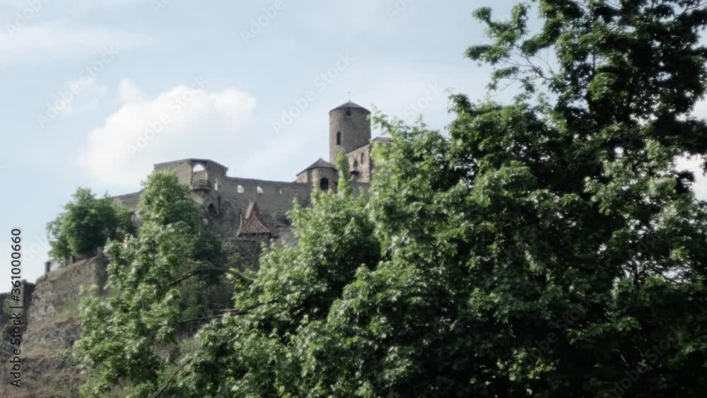 Strekov castle in Bohemia during spring with blue sky and green trees Strekov castle in Bohemia during spring with blue sky and green trees
