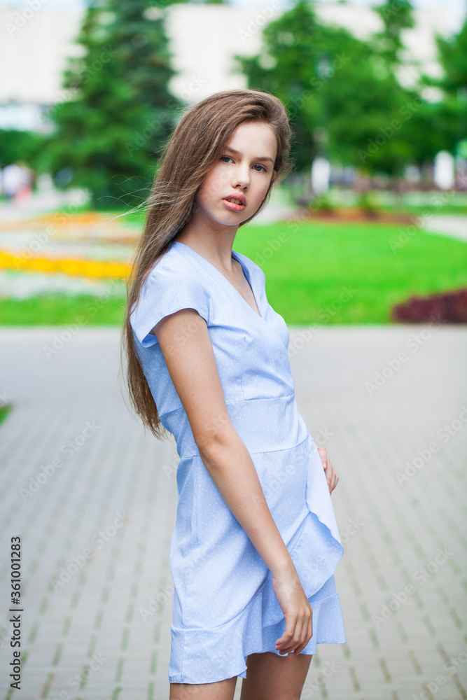 Portrait of a young beautiful teenager girl in blue dress Portrait of a young beautiful teenager girl in blue dress