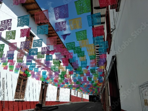 Mexican street colorful flag with papel picado Day of Dead