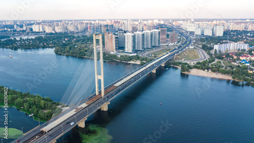 Aerial top view of South Bridge in Kiev city from above, Kyiv skyline and Dnieper river cityscape, Ukraine 