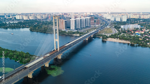 Aerial top view of South Bridge in Kiev city from above, Kyiv skyline and Dnieper river cityscape, Ukraine 