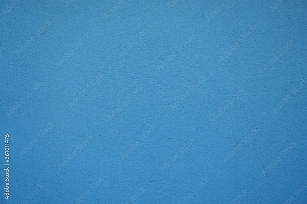 Naklejka premium Clean blue color rough surface concrete wall