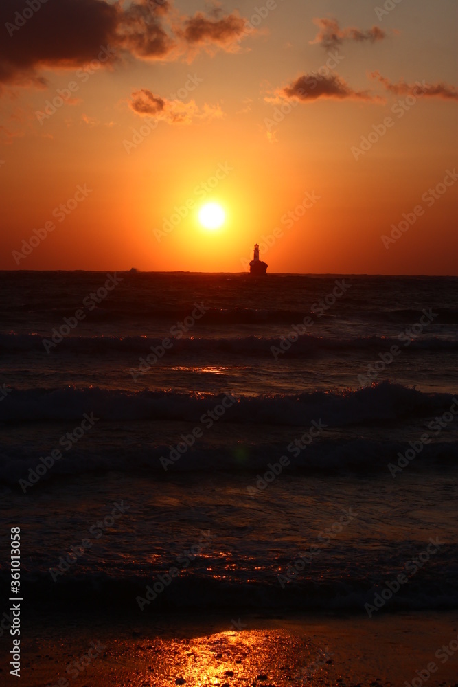 Sunrise at the lighthouse of Tourlitis at Andros, Greece Sunrise at the lighthouse of Tourlitis at Andros, Greece