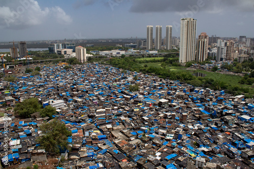 Tablou pe pânză Mumbai, Maharashtra, India; building and slum's aerial view