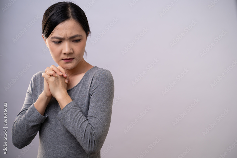 Asian woman thinking about problem, worried and confused emotion isolated on background. Asian woman thinking about problem, worried and confused emotion isolated on background.