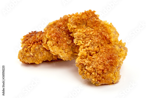 Crispy chicken fillet in breadcrumbs, isolated on white background
