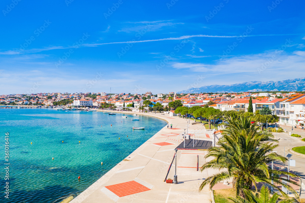 Croatia, beautiful Adriatic coastline, town of Novalja on the island of Pag, city center and marina aerial view from drone
