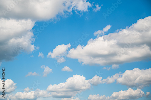 Beautiful background of blue sky with fluffy clouds