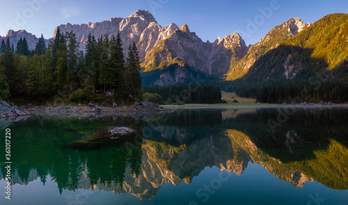 Fototapeta Naklejka Na Ścianę i Meble -  Panorama of an alpine lake on a beautiful sunny morning