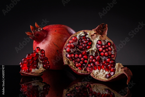 Pomegranate isolated on black background.