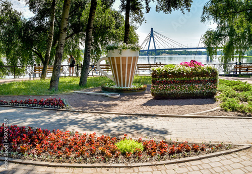 Flowerbed in the form of cake and cup of coffee on the banks of the Dnipro photo