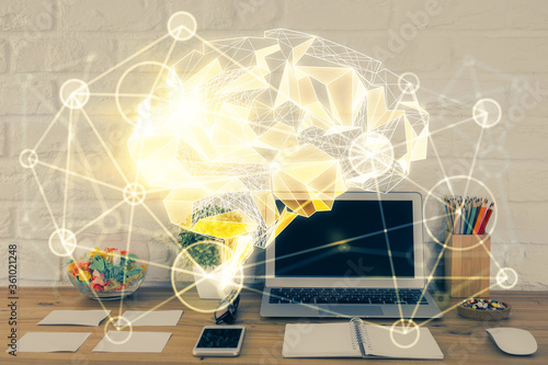 Double exposure of work space with computer and human brain drawing hologram. Brainstorm concept.