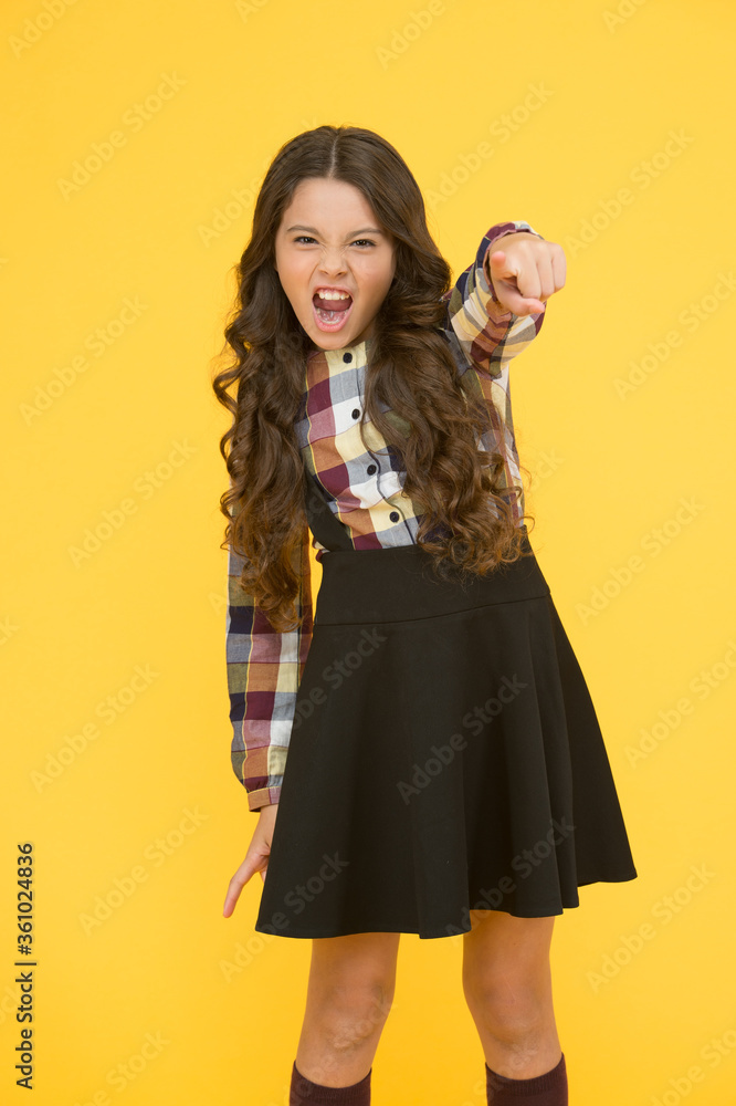 Hey you. Manners of hothead. Girl long hair cool pointing forward. Child pointing camera yellow background. Kid pointing at you index finger. Communication concept. Happy childhood. Come with me Hey you. Manners of hothead. Girl long hair cool pointing forward. Child pointing camera yellow background. Kid pointing at you index finger. Communication concept. Happy childhood. Come with me