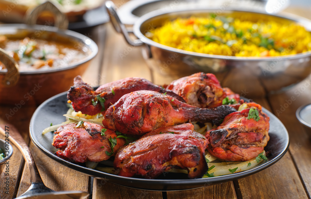 indian tandoori chicken with onions and cilantro