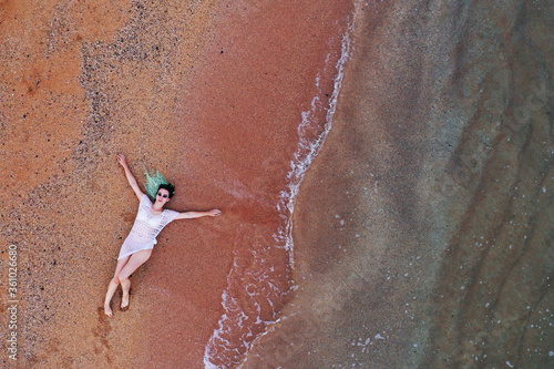 overhead view of woman on the beach
