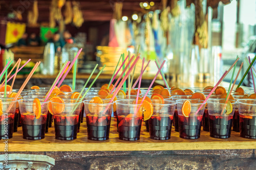 plastic glasses with typical spanish sangria on a bar on the beach