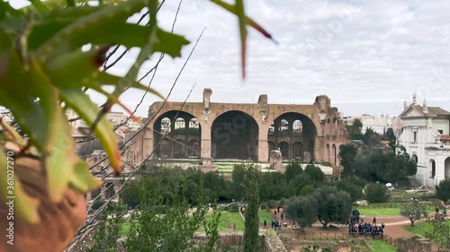 Revealing Shot Of The Basilica Of Maxentius From The Roman Forum Viewpoint In Rome, Italy - sliding reveal shot photo