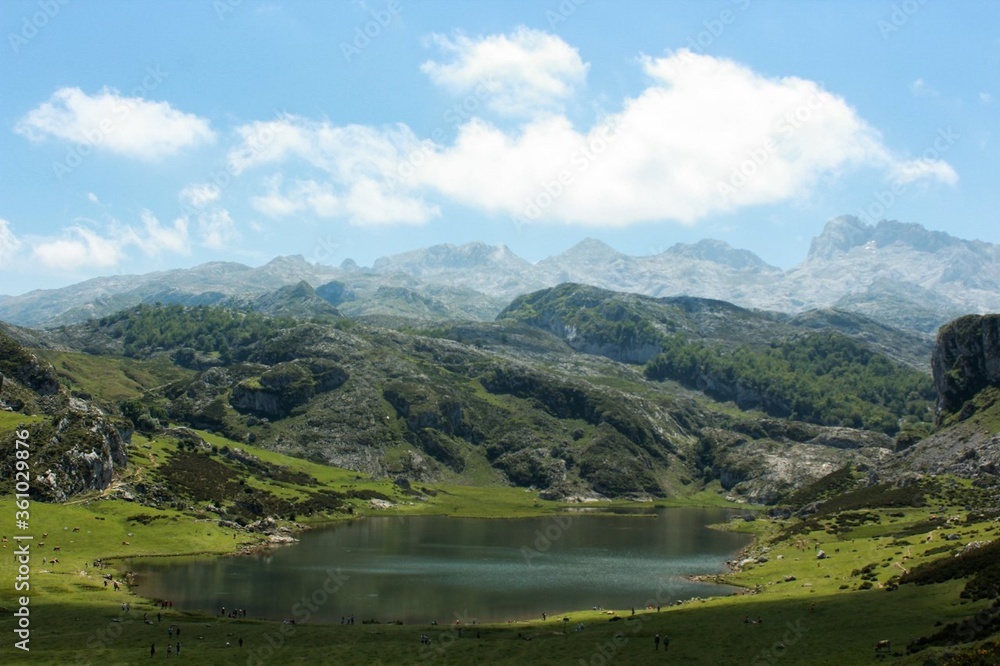 custom made wallpaper toronto digitallandscape of mountains, a lake with reflections in the water and clouds in Peaks of Europe (Asturias, Spain) / paisaje de montañas con un rÃo con reflejos en el agua y nubes en Picos de Europa
